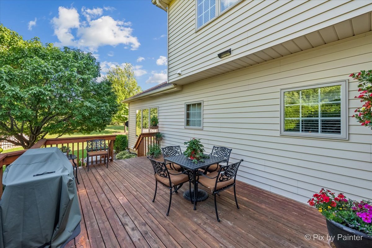 3720 Cypress Drive Spring Grove, IL 60071 - Photo 43 of 55 a view of a chairs and table on the wooden deck