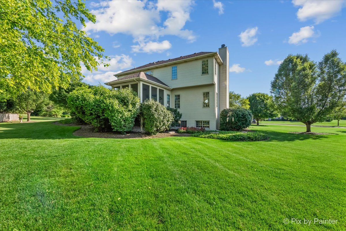 3720 Cypress Drive Spring Grove, IL 60071 - Photo 44 of 55 a front view of a house with garden