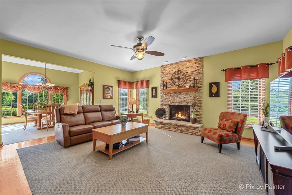 3720 Cypress Drive Spring Grove, IL 60071 - Photo 5 of 55 a living room with furniture and a fireplace