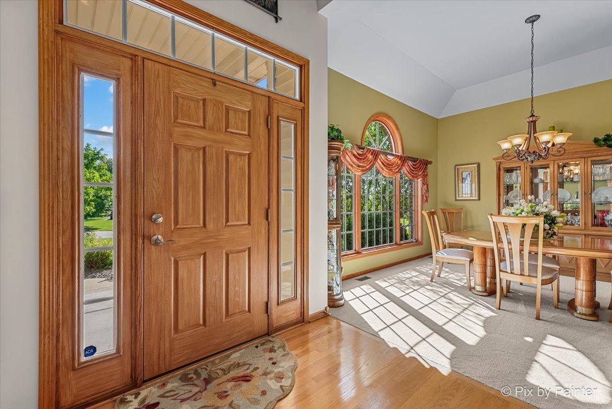 3720 Cypress Drive Spring Grove, IL 60071 - Photo 10 of 55 a view of a hallway with furniture and a window