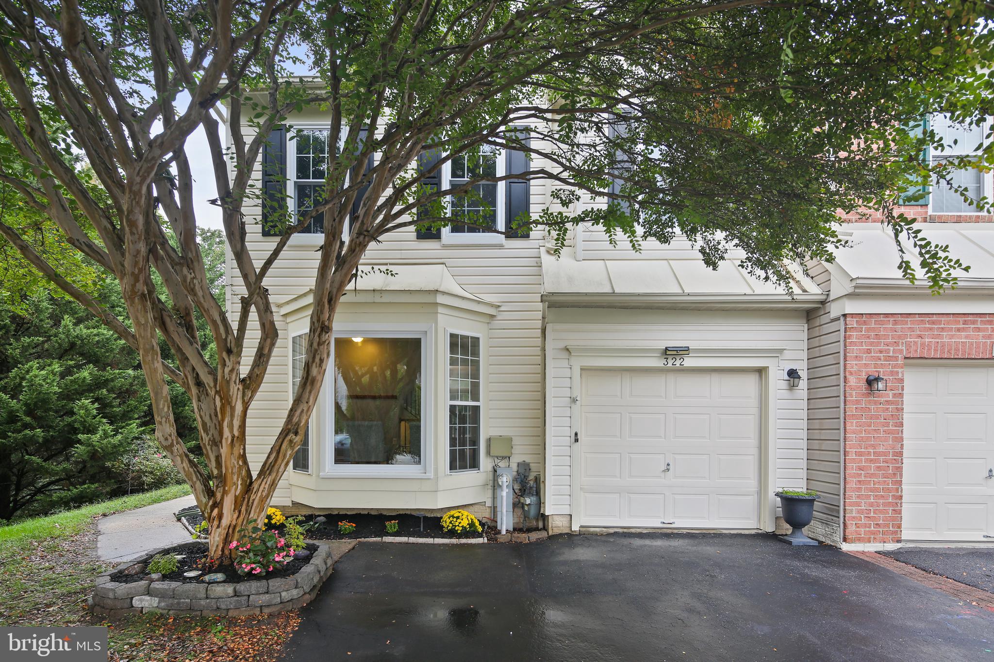 322 Timberbrook Court Odenton, MD 21113 - Photo 1 of 31 a front view of a house with garden