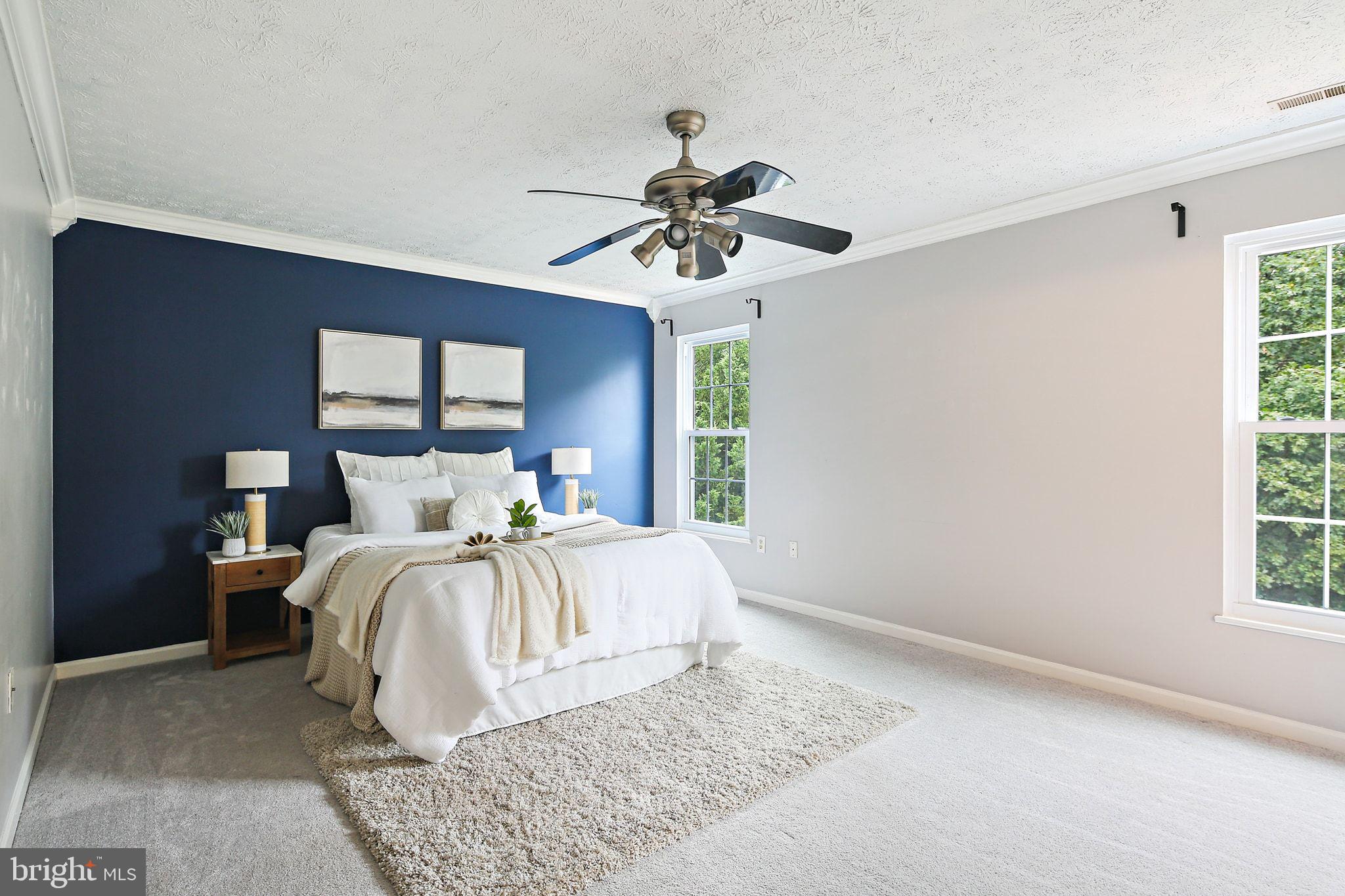 322 Timberbrook Court Odenton, MD 21113 - Photo 14 of 31 a bed room with a bed and a chandelier