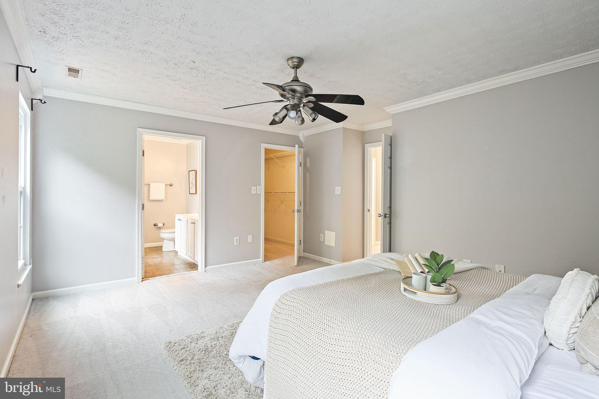 322 Timberbrook Court Odenton, MD 21113 - Photo 16 of 31 a bedroom with a bed chandelier and a window