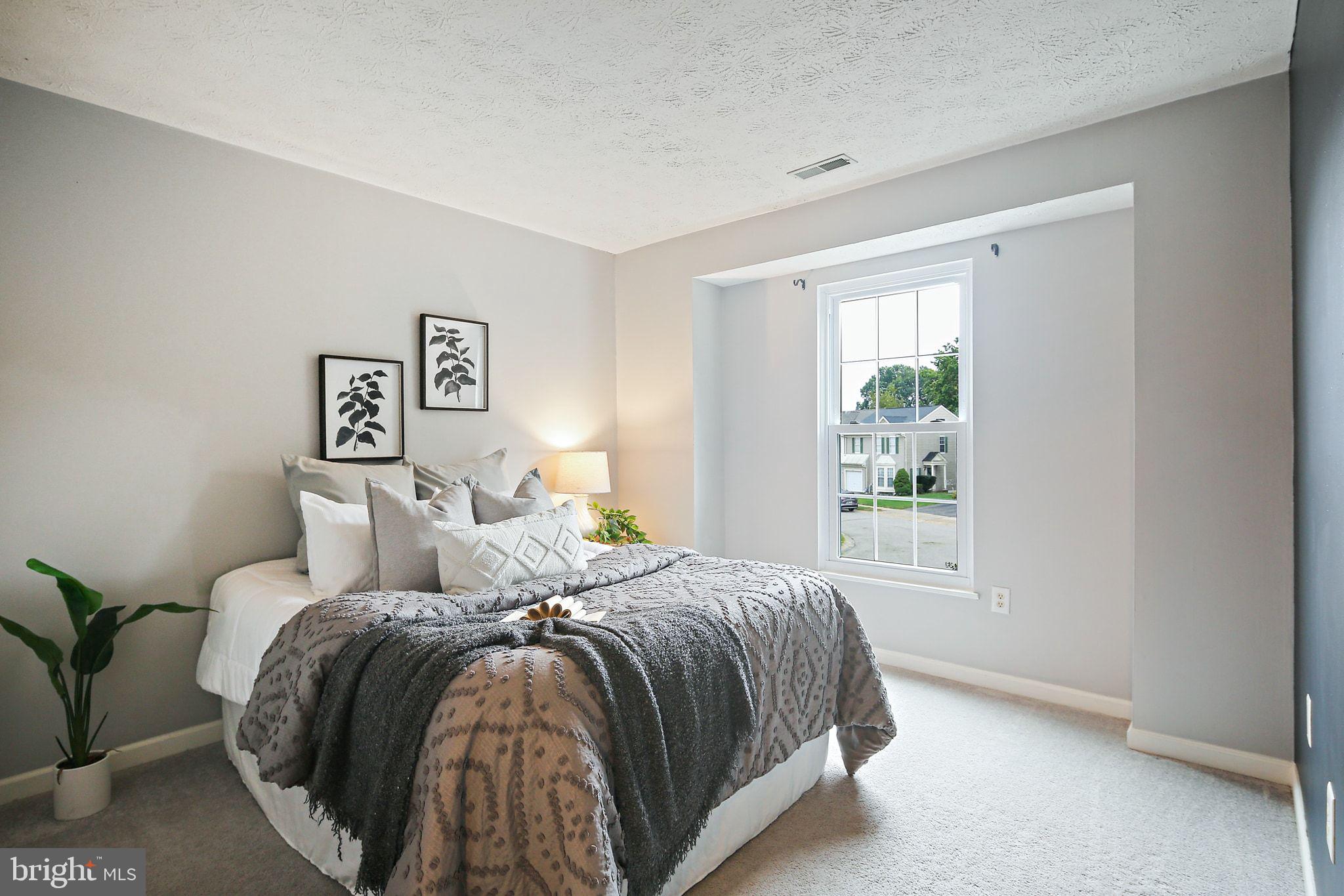 322 Timberbrook Court Odenton, MD 21113 - Photo 20 of 31 a bedroom with a bed and a window