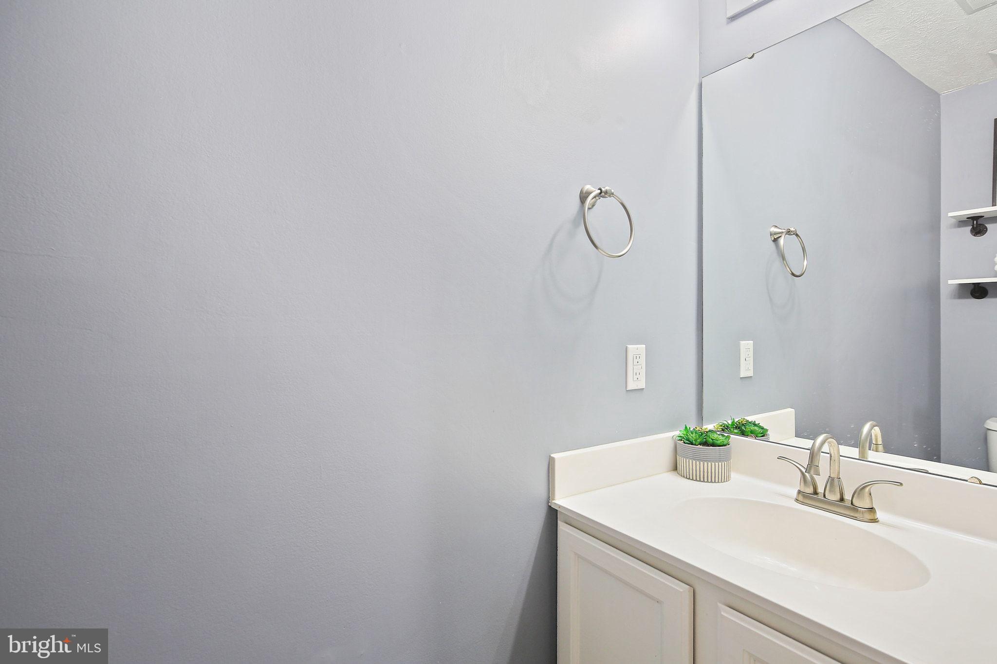 322 Timberbrook Court Odenton, MD 21113 - Photo 27 of 31 a bathroom with a sink and a mirror