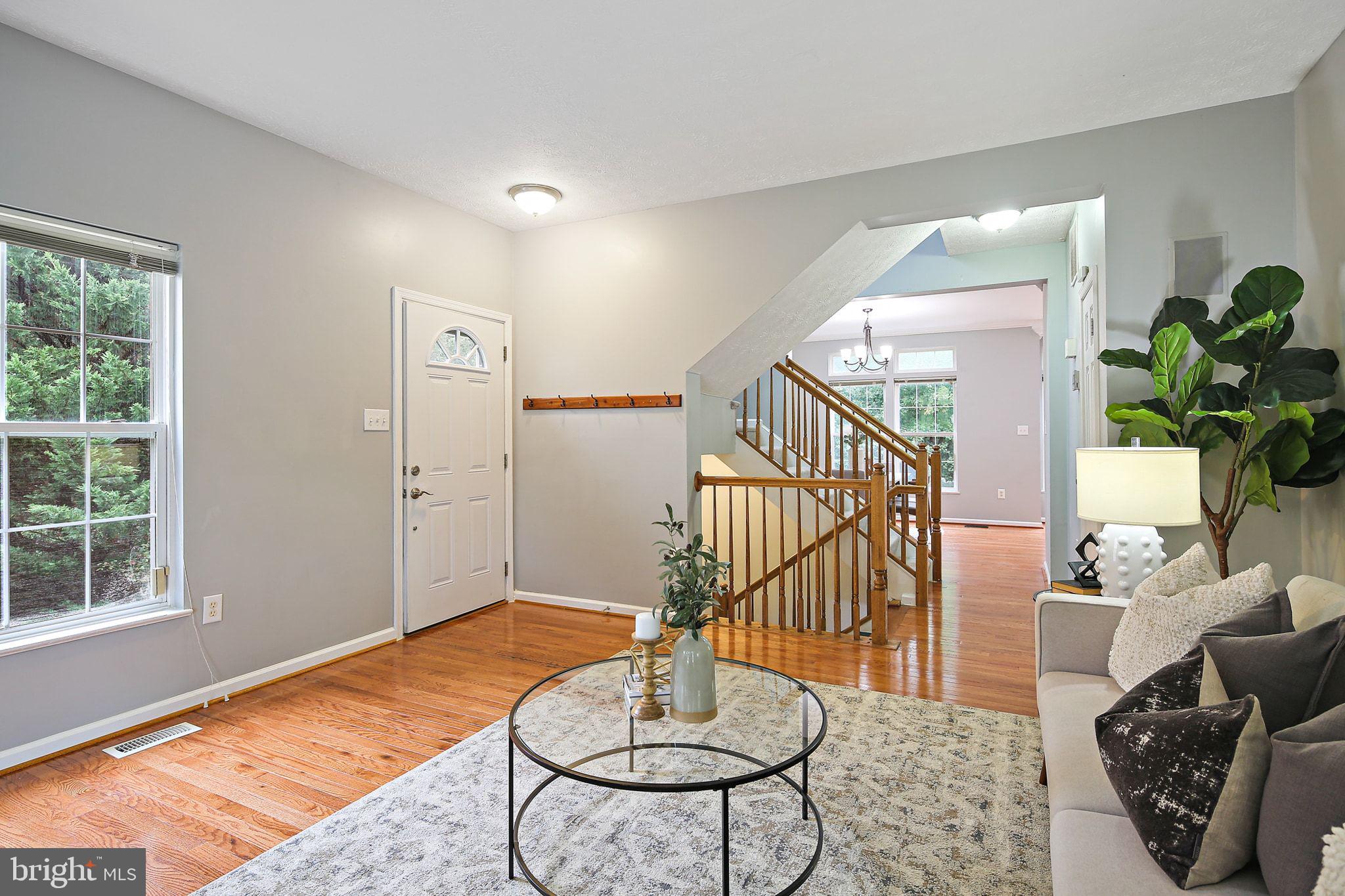 322 Timberbrook Court Odenton, MD 21113 - Photo 5 of 31 a living room with furniture and a table