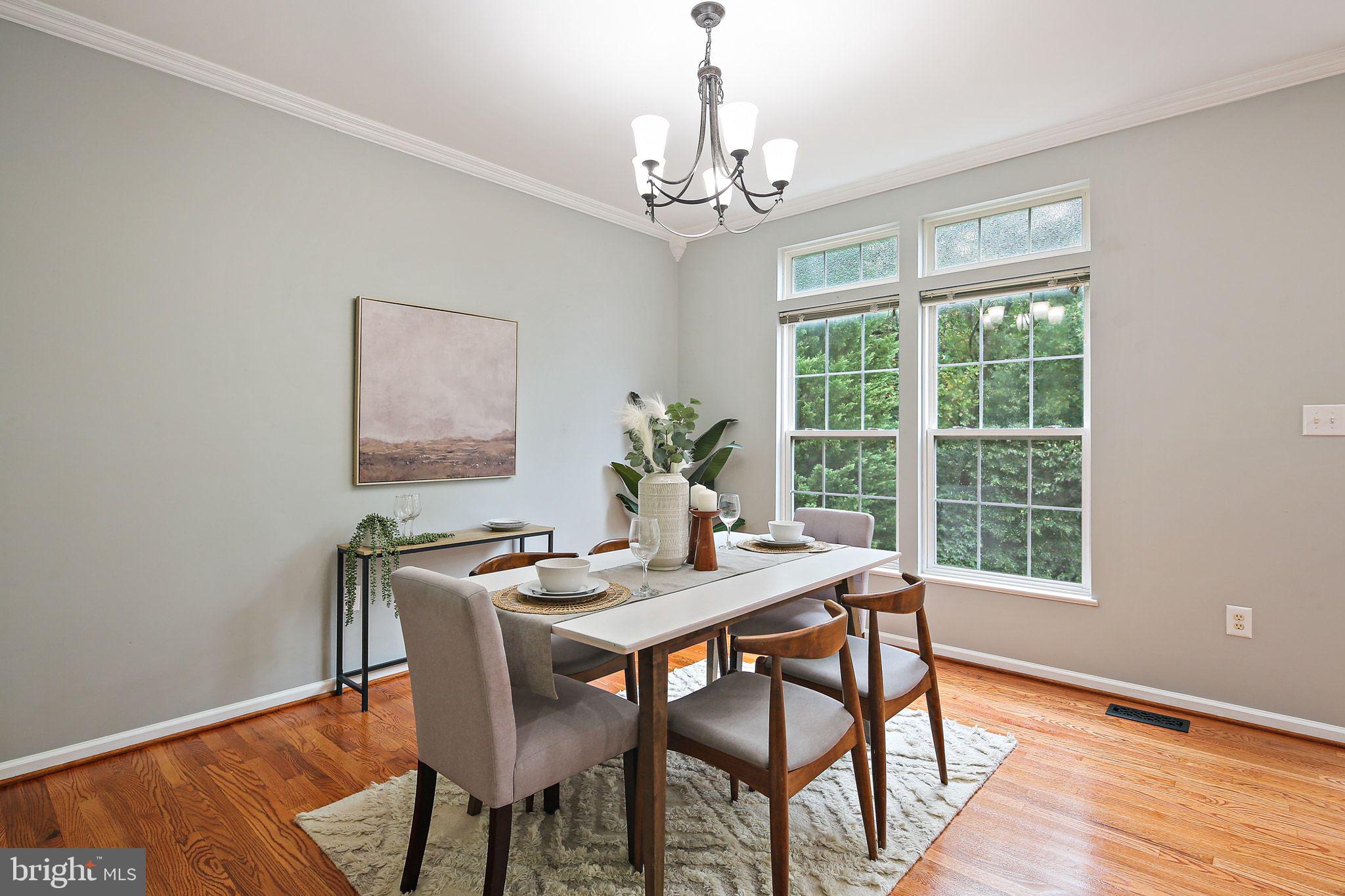 322 Timberbrook Court Odenton, MD 21113 - Photo 6 of 31 a dining room with furniture a chandelier and wooden floor