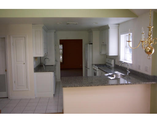 121 Hackensack Road Boston, MA 02467 - Photo 2 of 9 a bathroom with a sink and a mirror