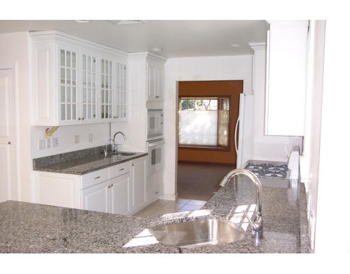 121 Hackensack Road Boston, MA 02467 - Photo 4 of 9 a kitchen with granite countertop a sink and a stove