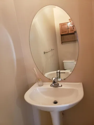 a bathroom with a sink and mirror