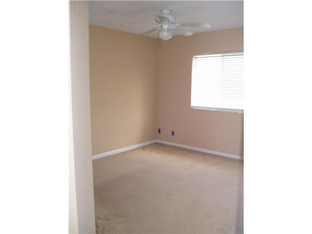 3027 North Evergreen Circle, Unit 3027 Boynton Beach, FL 33426 - Photo 32 of 35 a view of an empty room with a window