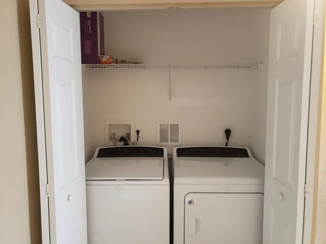 a utility room with dryer and washer