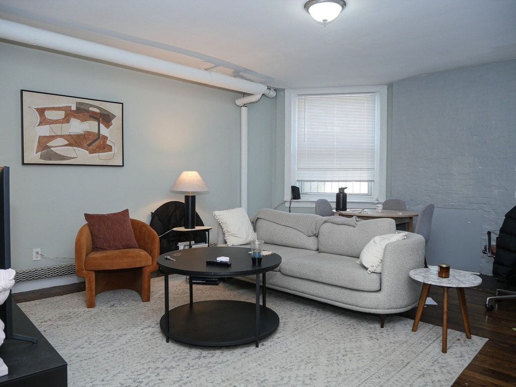 45 Carlton Street, Unit 9 Brookline, MA 02446 - Photo 2 of 8 a living room with furniture