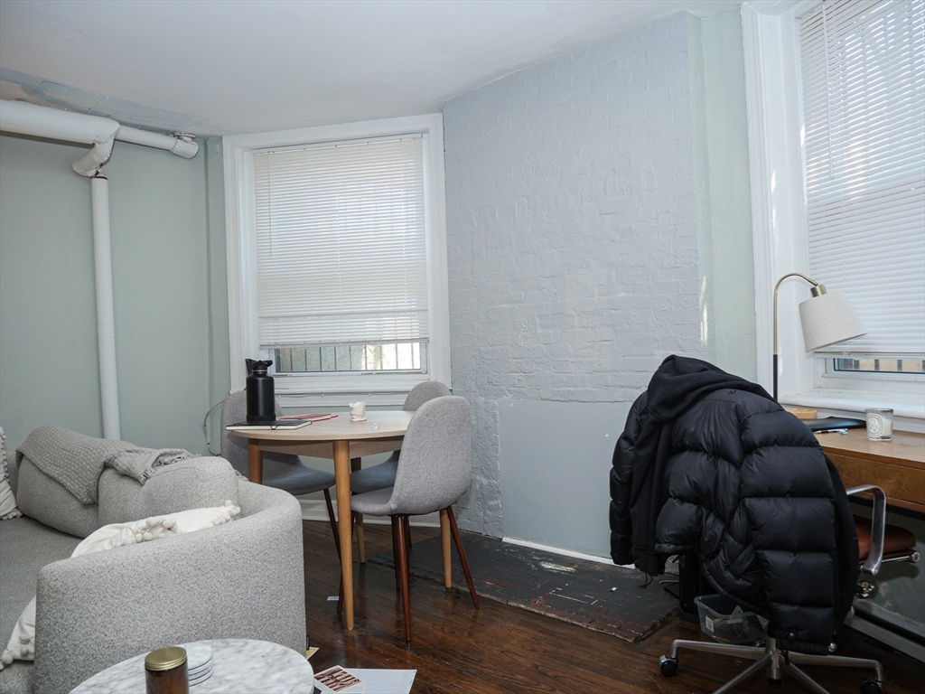 45 Carlton Street, Unit 9 Brookline, MA 02446 - Photo 5 of 8 a living room with furniture and a window