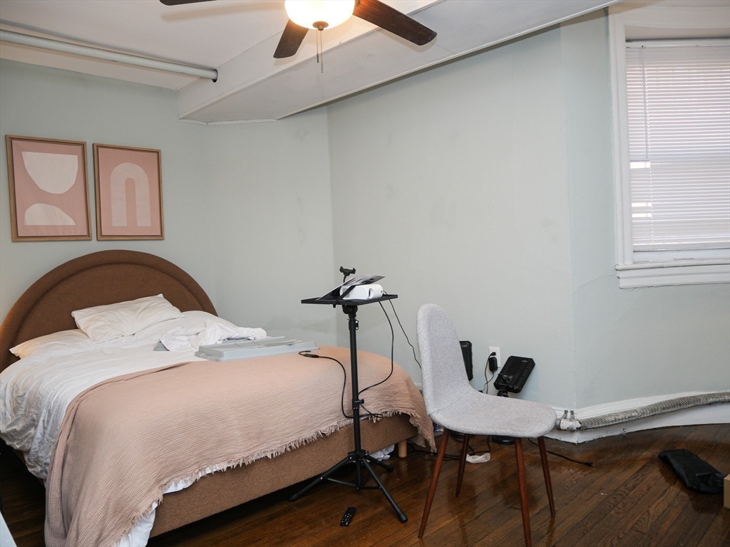 45 Carlton Street, Unit 9 Brookline, MA 02446 - Photo 6 of 8 a bedroom with a bed and a window