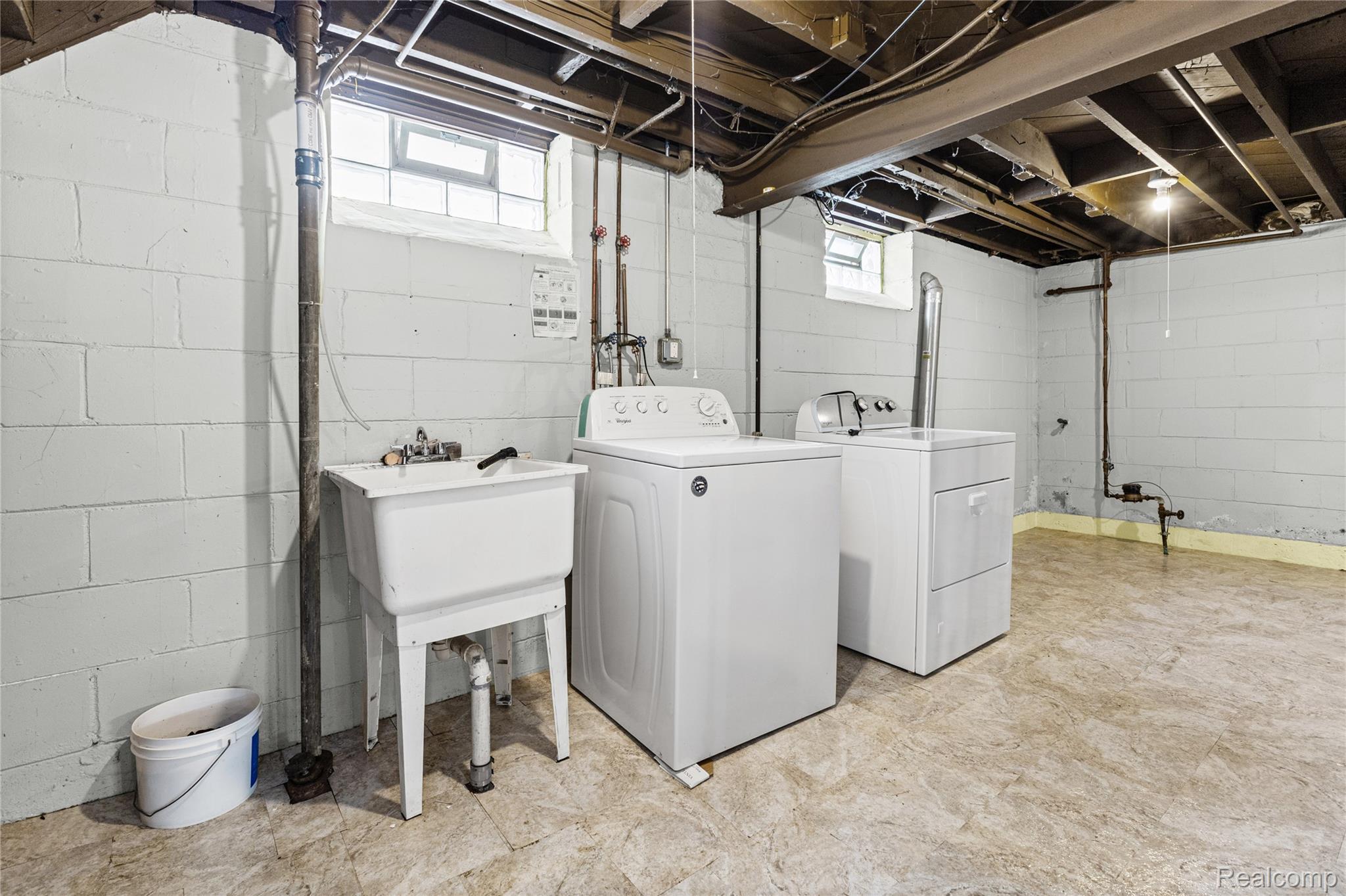 26508 Five Mile Road Redford, MI 48239 - Photo 33 of 41 Laundry area featuring a utility sink, washing machine, and clothes dryer