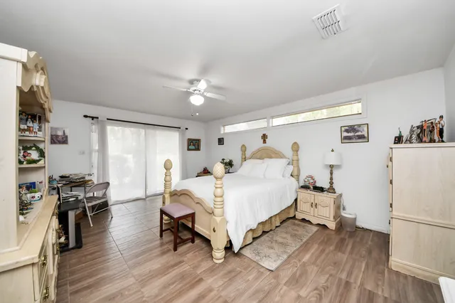 a bedroom with a bed furniture and a window