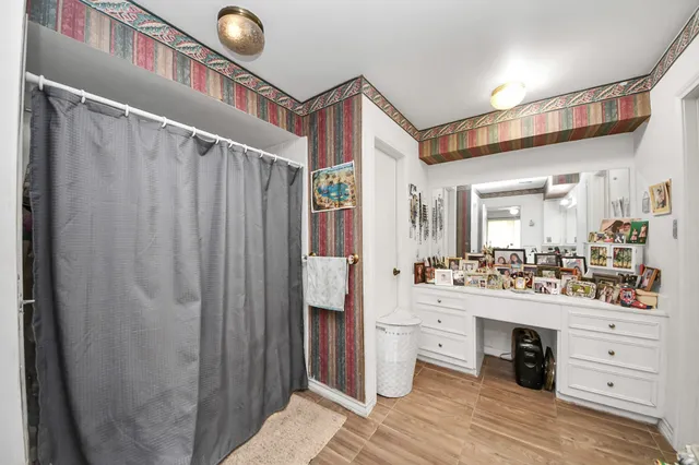 a kitchen with a refrigerator and sink
