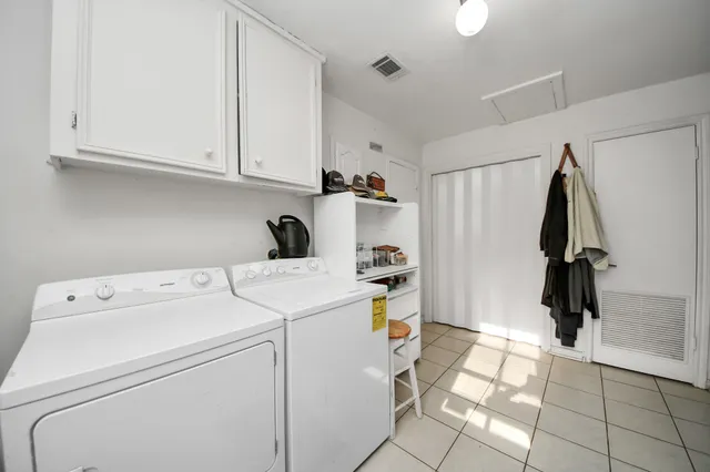 a view of storage and utility room with washer and dryer