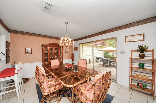 a kitchen with a refrigerator and a stove
