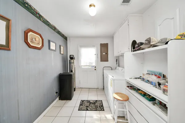 a kitchen with granite countertop a sink and a stove top oven