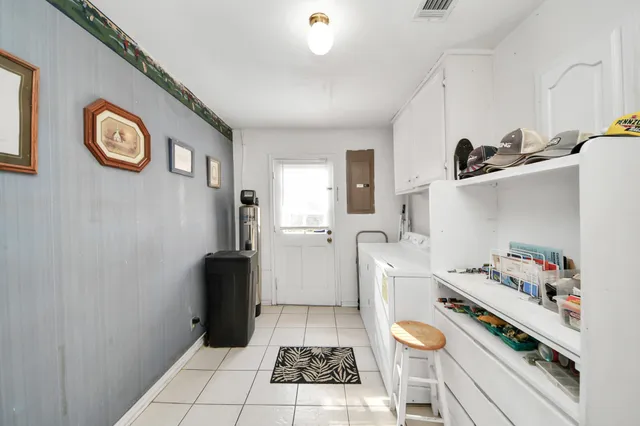 a kitchen with granite countertop a sink and a stove top oven