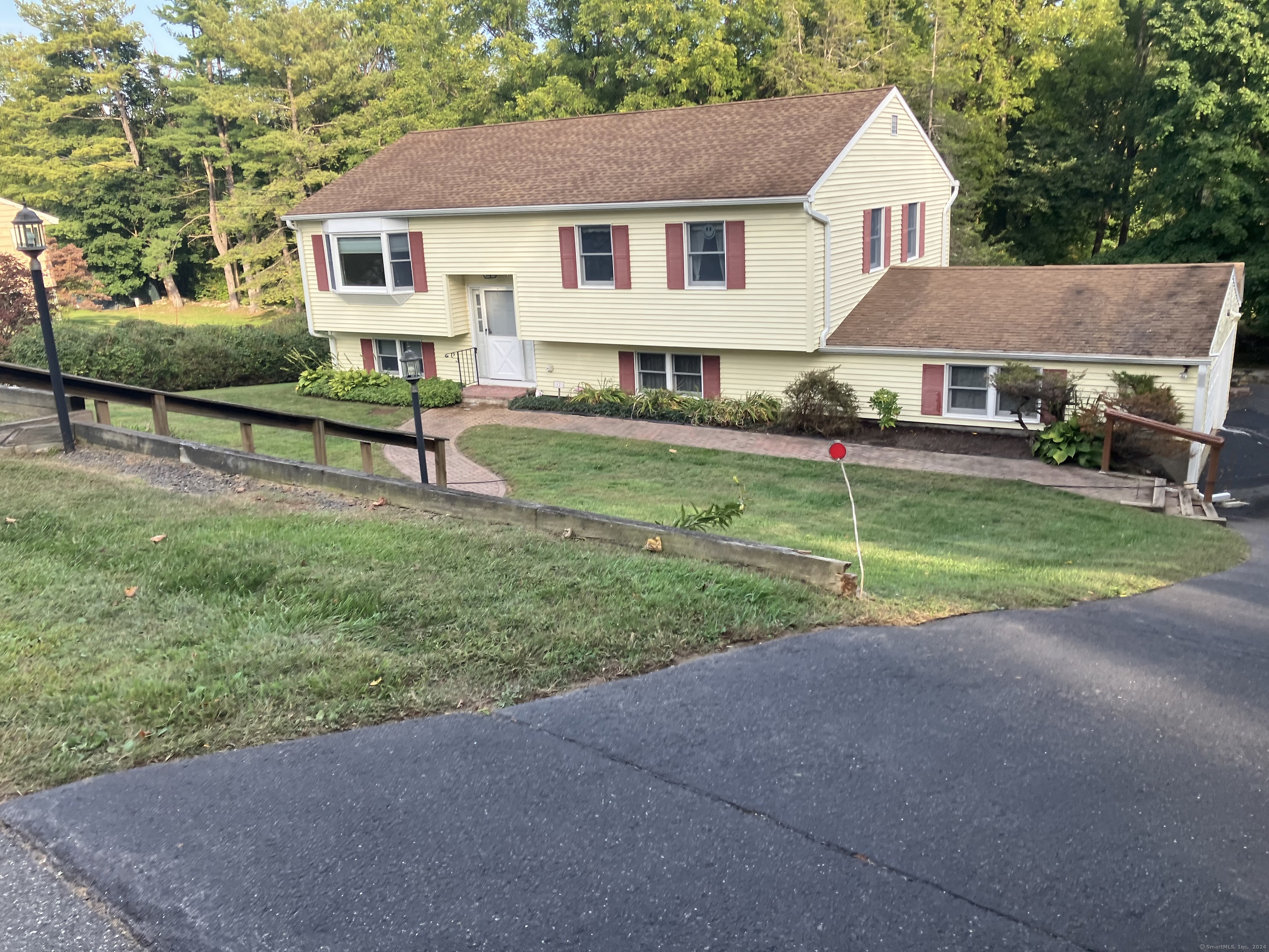 12 Russeling Ridge New Milford, CT 06776 - Photo 1 of 1 a view of a house with a yard and sitting area