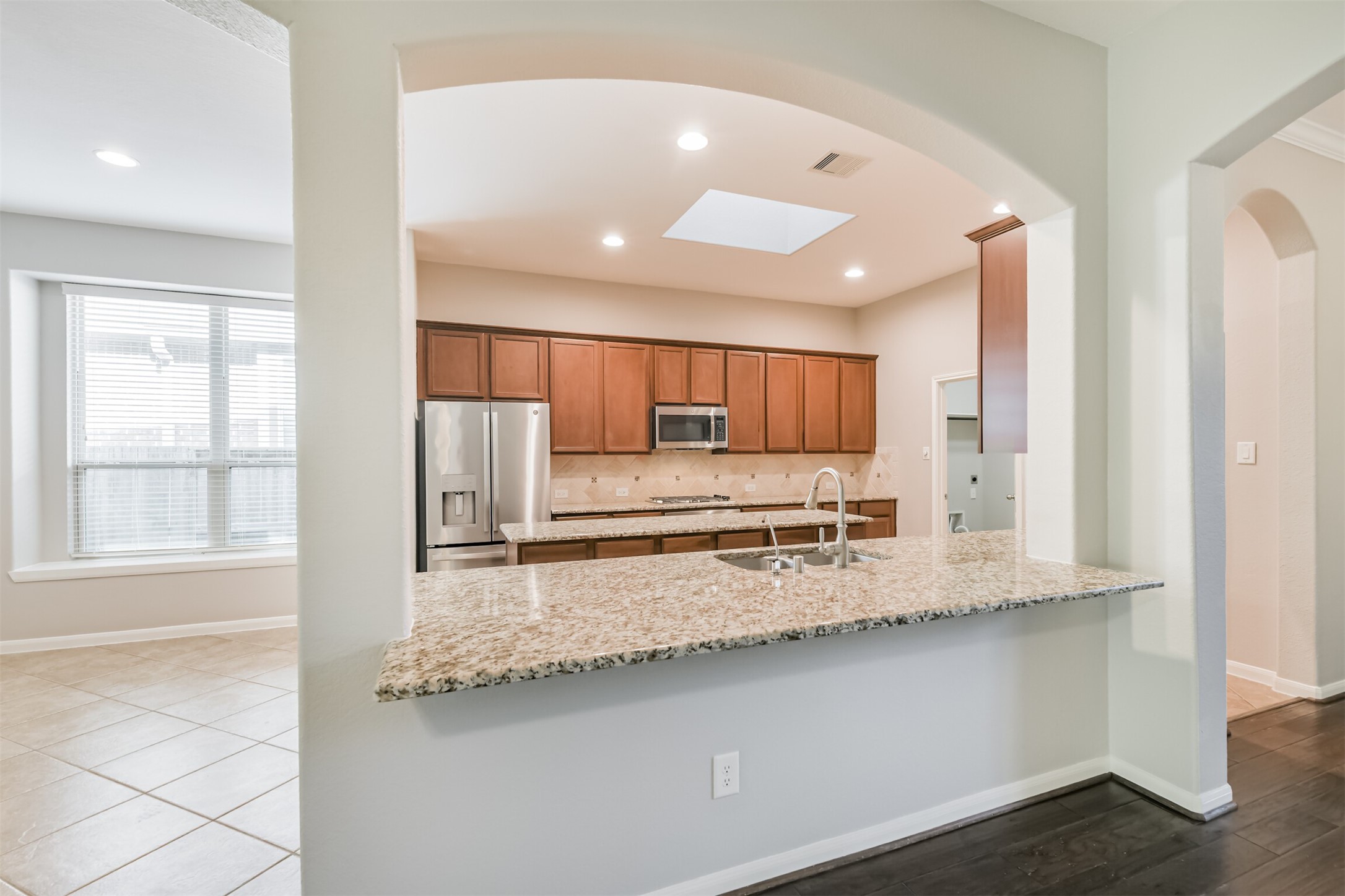 19527 Juniper Breeze Lane Spring, TX 77379 - Photo 11 of 49 a large kitchen with a large window
