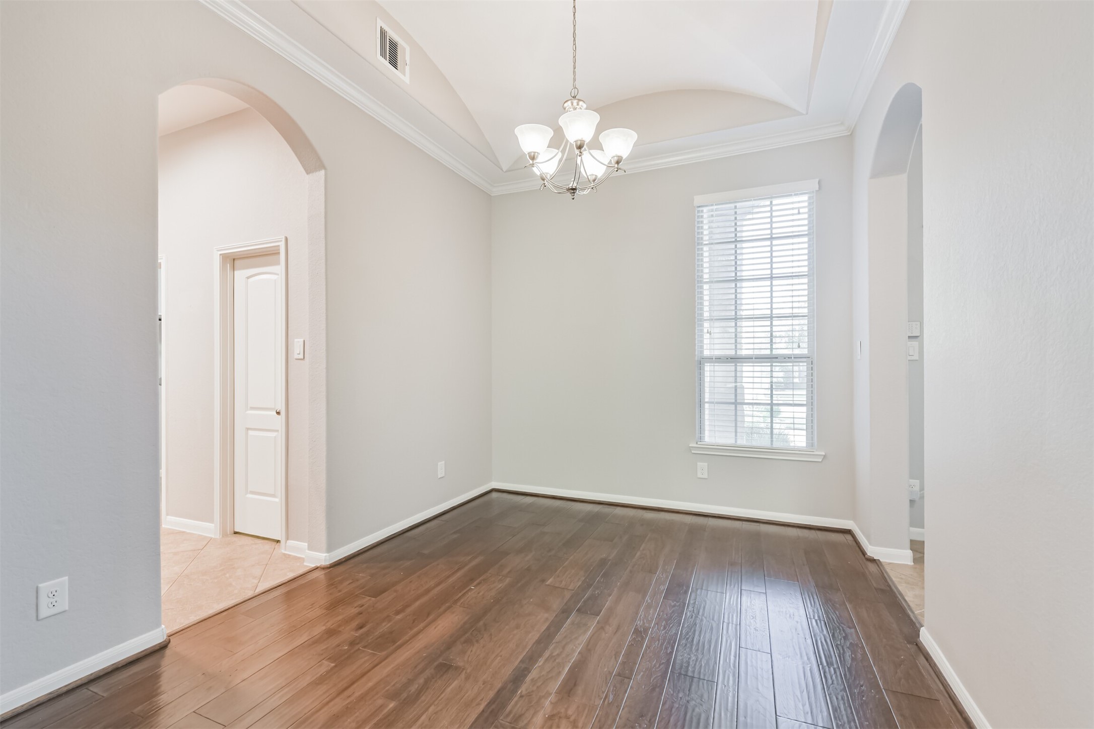 19527 Juniper Breeze Lane Spring, TX 77379 - Photo 19 of 49 wooden floor in an empty room with a window