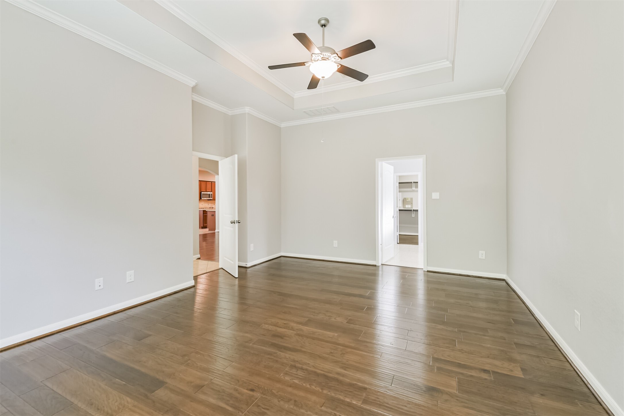 19527 Juniper Breeze Lane Spring, TX 77379 - Photo 23 of 49 an empty room with wooden floor and a ceiling fan