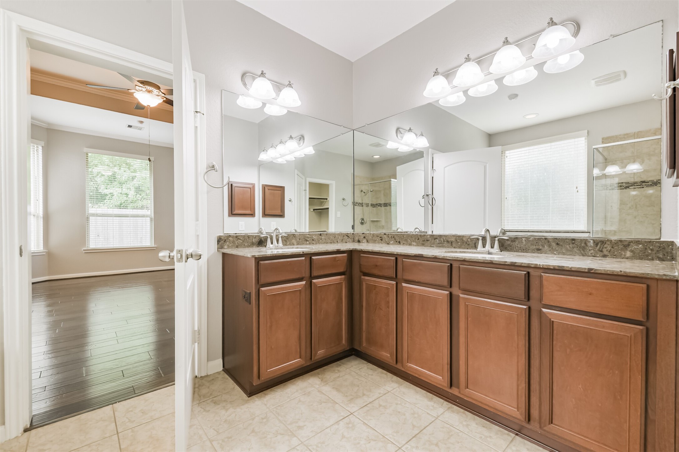 19527 Juniper Breeze Lane Spring, TX 77379 - Photo 25 of 49 a bathroom with a sink vanity and mirror