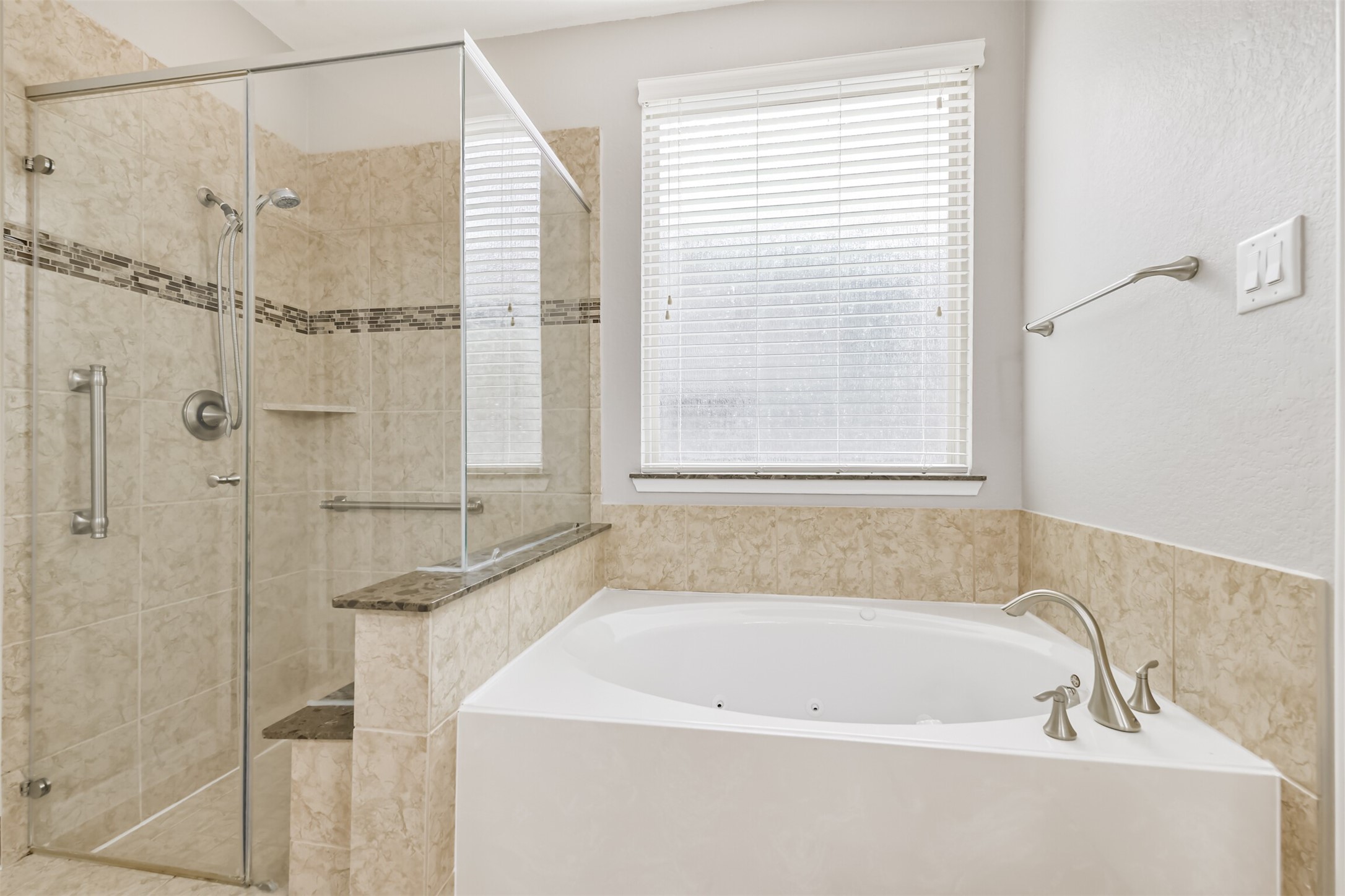 19527 Juniper Breeze Lane Spring, TX 77379 - Photo 26 of 49 a white bath tub sitting next to a shower