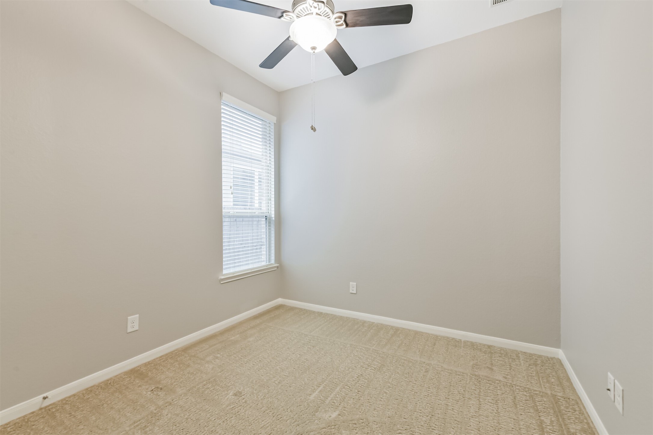 19527 Juniper Breeze Lane Spring, TX 77379 - Photo 34 of 49 an empty room with a window and a fan