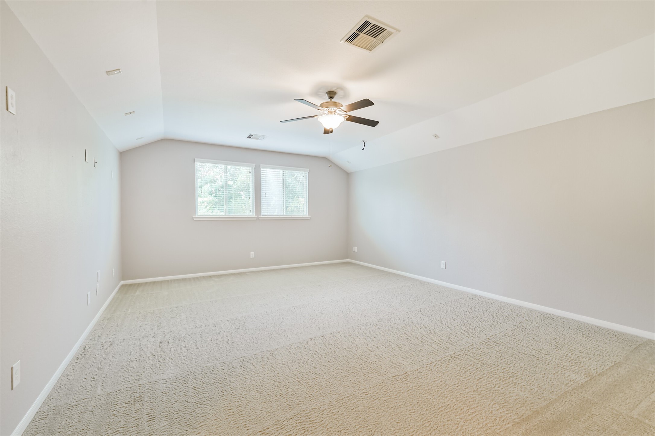 19527 Juniper Breeze Lane Spring, TX 77379 - Photo 36 of 49 an empty room with a window and a ceiling fan