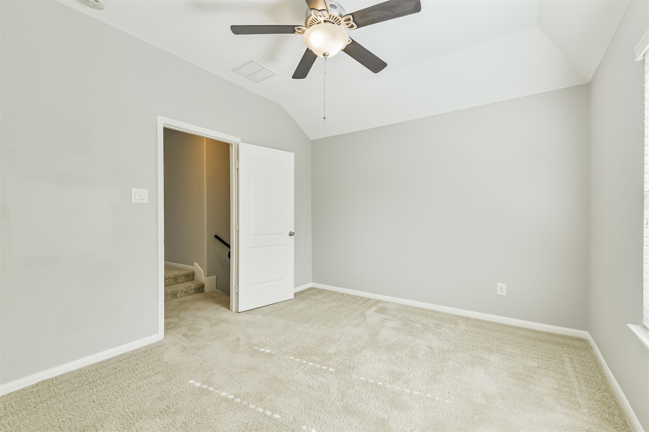 19527 Juniper Breeze Lane Spring, TX 77379 - Photo 40 of 49 an empty room with chandelier fan
