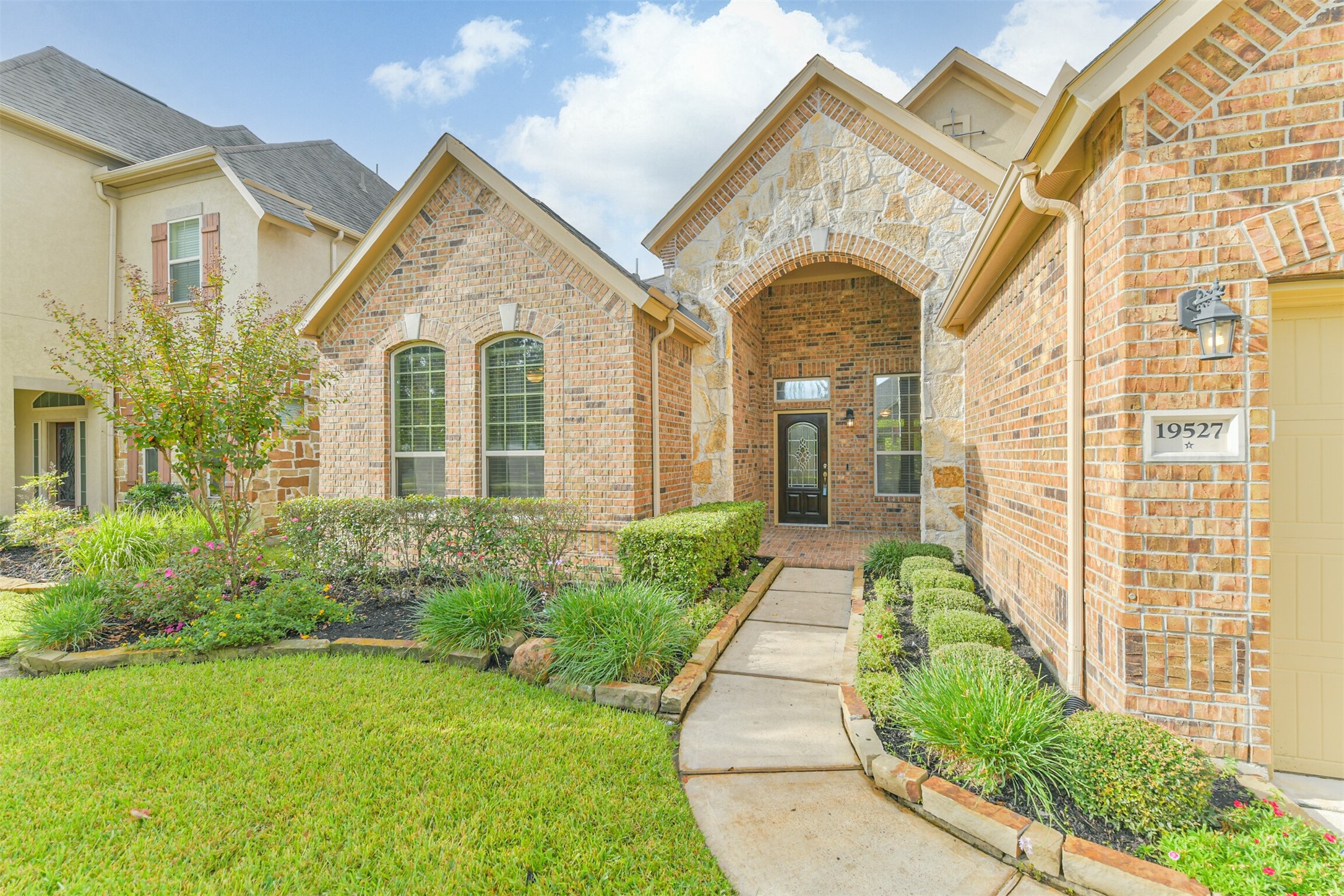 19527 Juniper Breeze Lane Spring, TX 77379 - Photo 4 of 49 a front view of a house with garden