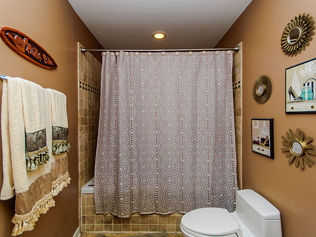 1344 West Madison Street, Unit 303 Chicago, IL 60607 - Photo 11 of 20 a bathroom with a sink toilet and shower