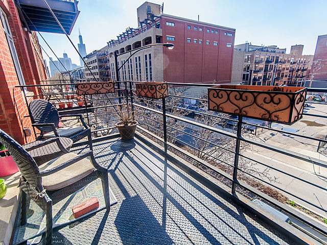 1344 West Madison Street, Unit 303 Chicago, IL 60607 - Photo 18 of 20 a view of a patio with wooden floor