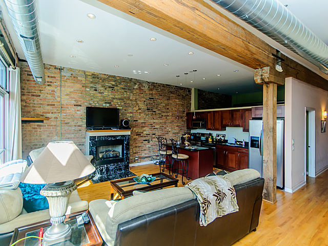 1344 West Madison Street, Unit 303 Chicago, IL 60607 - Photo 6 of 20 a outdoor living space with furniture a flat screen tv and a fireplace