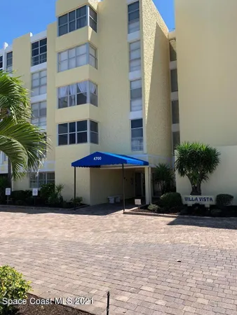 a hallway with a black white checkered floor