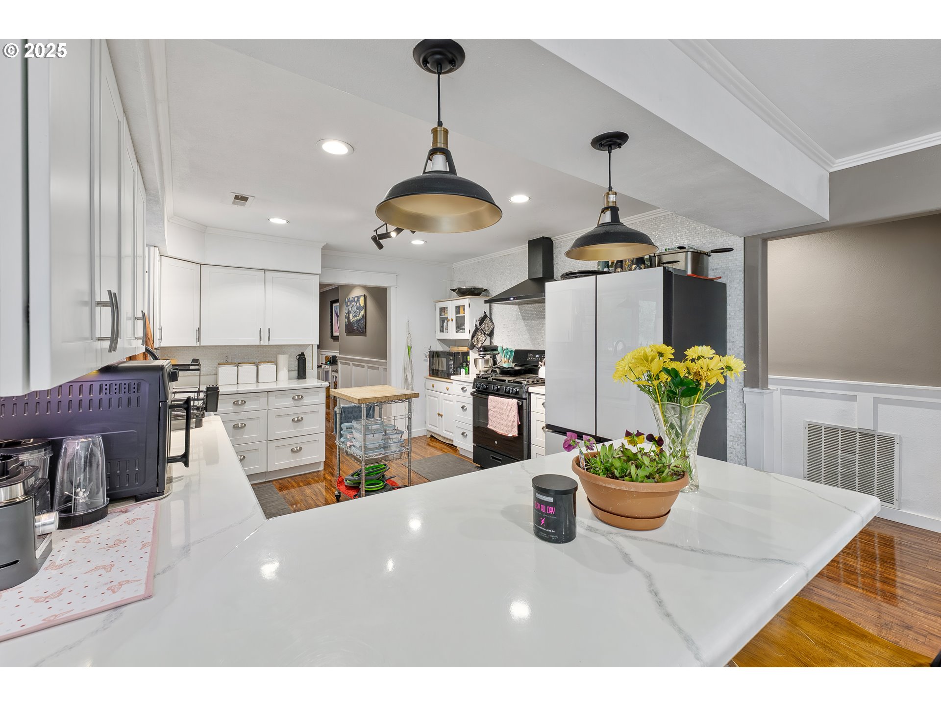 190 Walnut Street Myrtle Creek, OR 97457 - Photo 19 of 48 a view of a dining room and livingroom with furniture wooden floor a chandelier