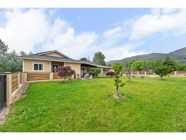 a front view of a house with garden
