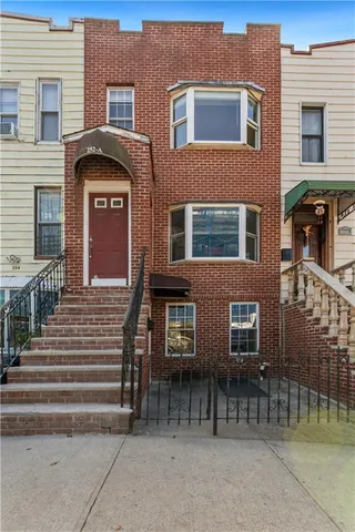 a front view of a house with a outdoor space