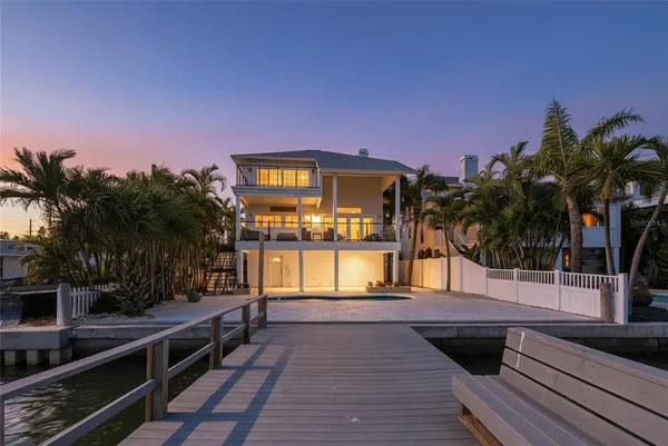 an aerial view of a house with outdoor space