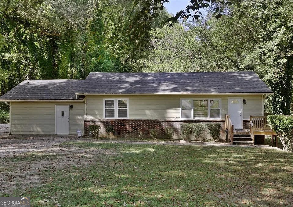 1865 Kimberly Road Southwest Atlanta, GA 30331 - Photo 1 of 1 a front view of a house with a yard