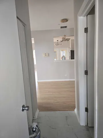 a kitchen with stainless steel appliances and a refrigerator
