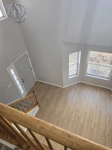 a bathroom with a double vanity sink a mirror and a bathtub