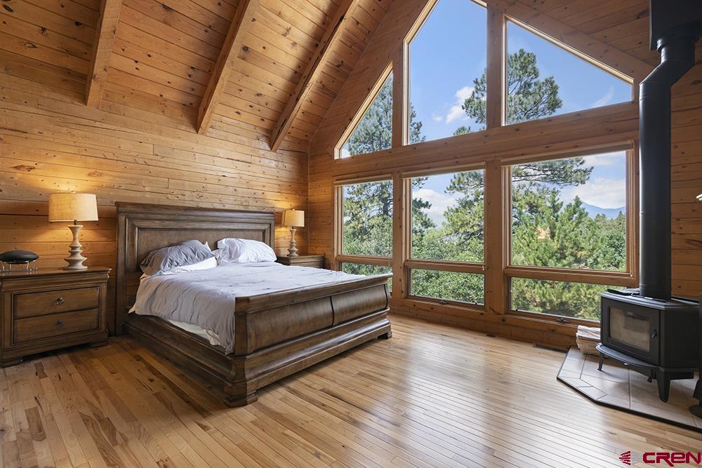 154 N Road Durango, CO 81303 - Photo 12 of 35 a bedroom with a bed and wooden floor