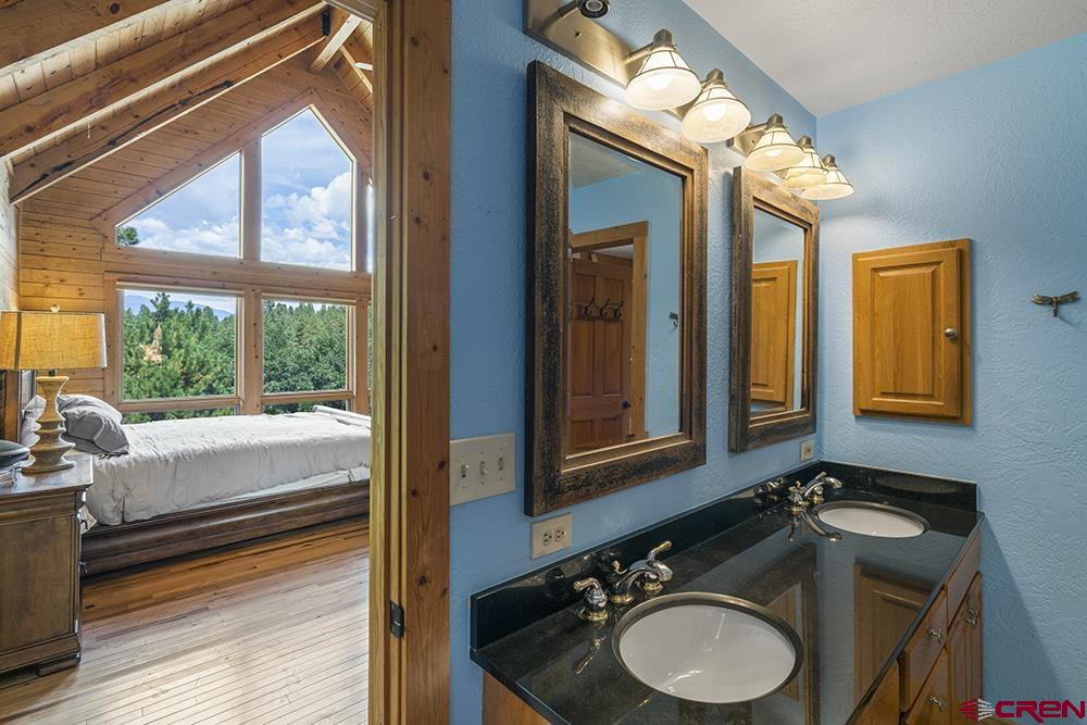 154 N Road Durango, CO 81303 - Photo 15 of 35 a bathroom with a sink and a mirror