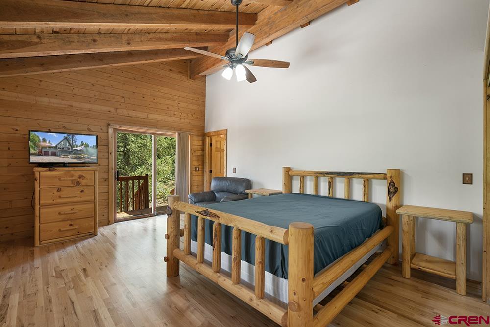 154 N Road Durango, CO 81303 - Photo 20 of 35 a bed sitting in a bedroom next to a window